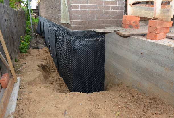 Happy homeowners after waterproofing job in Bear Creek